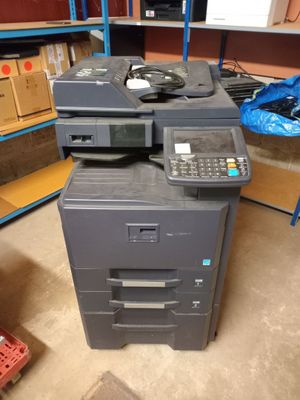 an image of a multi - function printer in a warehouse