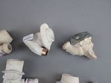 many different types of clay figurines displayed on a table