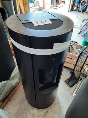 an image of a black and white stove in a garage