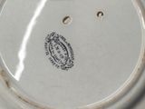 a white plate with a black and white design on it