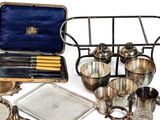 a lot of silver items that are on the table