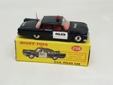 a toy police car sitting on top of a box