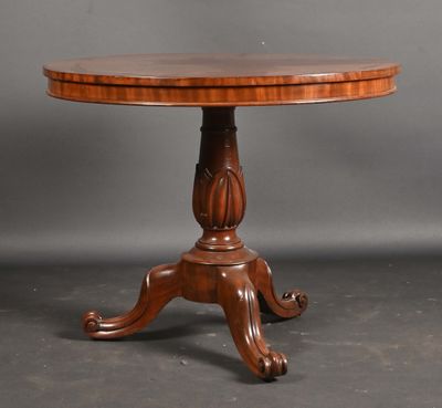 a round table with a wooden top and a wooden base