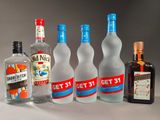 several bottles of alcohol are lined up on a table