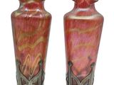 two vases that are sitting side by side on a white background