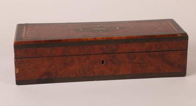 an old wooden box sitting on top of a white surface