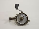 a close up of a metal pressurer on a white surface