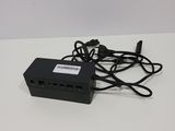 an image of a black power supply box with a cable attached to it
