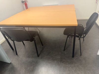 a table and four chairs in a room