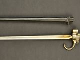 an image of a sword and a hook on a table