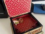 a box that is sitting on a desk with a mouse