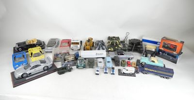 a lot of toy cars and trucks on a white surface