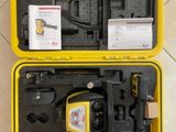 a yellow case filled with tools sitting on top of a tiled floor