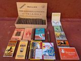 a box of cigars and a box of matches on a table