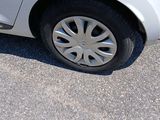 a white car parked on the side of the road