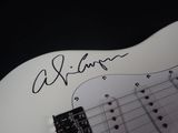 an electric guitar with a signed signature on the back of it