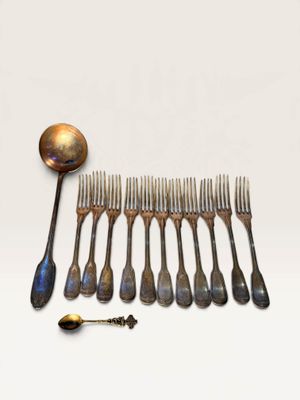 a lot of spoons and forks that are on the table