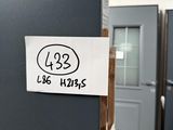 a sticker on the door of a building that has a sign on it