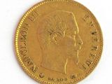 a gold coin with a picture of a man on it
