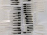 a close up of a bunch of screws in a plastic container