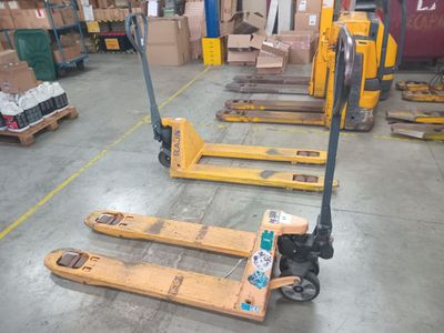 many pallets that are sitting in a warehouse