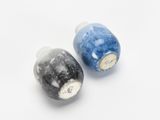 pair of salt and pepper shakers with blue and black speckles