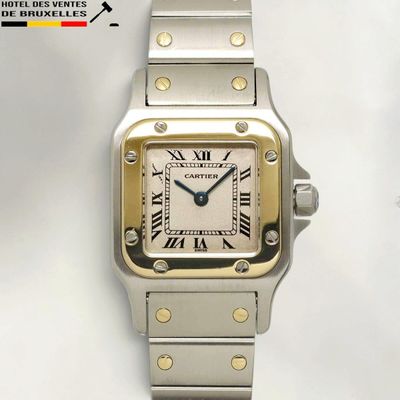 an image of a silver and gold wrist watch with roman numerals
