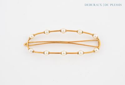 a close up of a hair pin with pearls on a white background