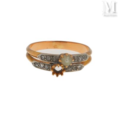 une image représentant une bague en or sertie d'une perle et de diamants
