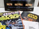 a lot of star wars books on the table