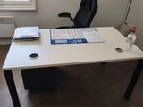 the desk in the office is empty and ready to be used