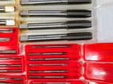 many different types of screws in a plastic box
