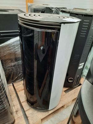 a black and white microwave sitting on top of a pallet