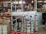 a picture of a warehouse with a lot of boxes and pallets
