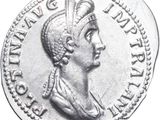 a close up of a silver coin with a woman ' s head on it