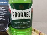 a bottle of proraso on a tray next to a can of soda