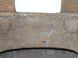 a close up of a piece of metal with a hole in it