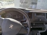 dashboard view of a car with a steering wheel and dashboard controls