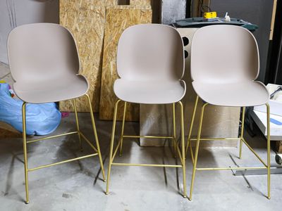 three chairs sitting next to each other in a room