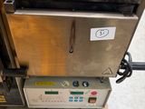 a machine that is sitting on top of a pallet