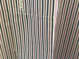 a close up of a striped shirt with a pocket on the chest