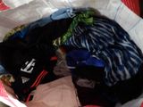 a bag full of clothes that is sitting on a table