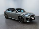 the new bmw x2 suv is parked in a showroom