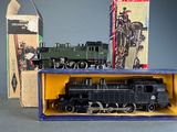 a box with a toy train in it and a box with a toy train in it