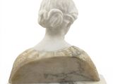 marble bust of a woman with a bun on her head