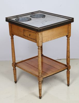 a small wooden table with a marble top on a white floor