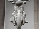 a picture of a motorcycle on display on the wall