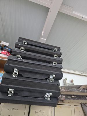 a stack of suitcases sitting on top of a pile of boxes