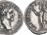 a silver coin with an image of a man holding a staff