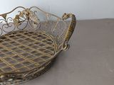 a metal basket that is sitting on a table